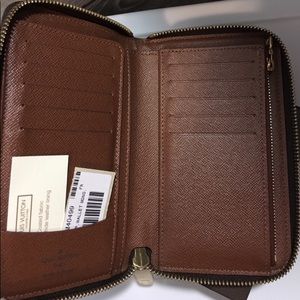 Louis Vuitton compact zippy wallet open book style
